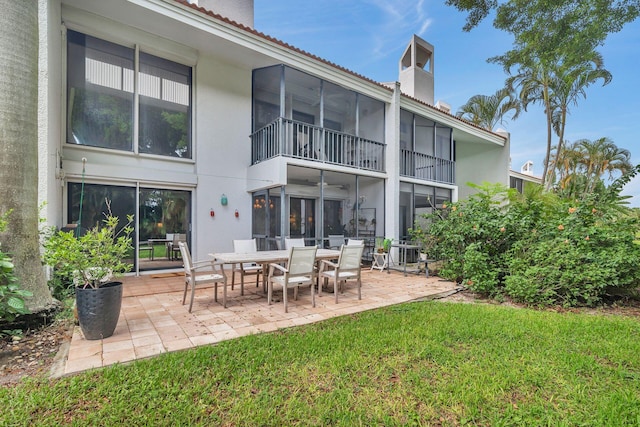 rear view of property with a yard, cooling unit, and a patio area