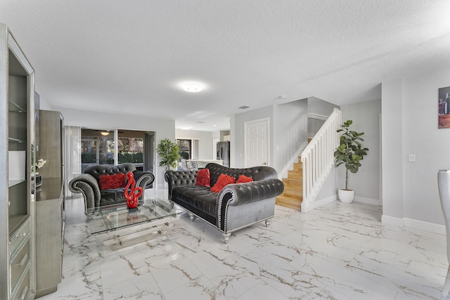 living room featuring a textured ceiling