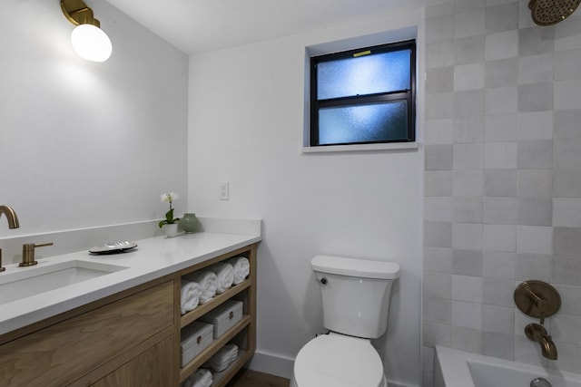 full bathroom with vanity, toilet, and tiled shower / bath