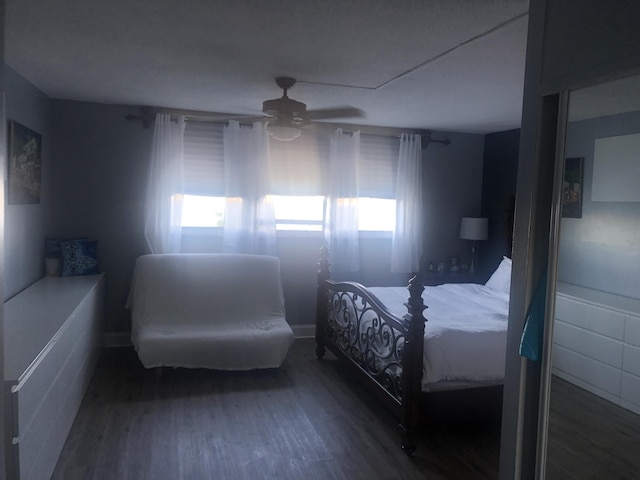 bedroom featuring ceiling fan and dark hardwood / wood-style flooring