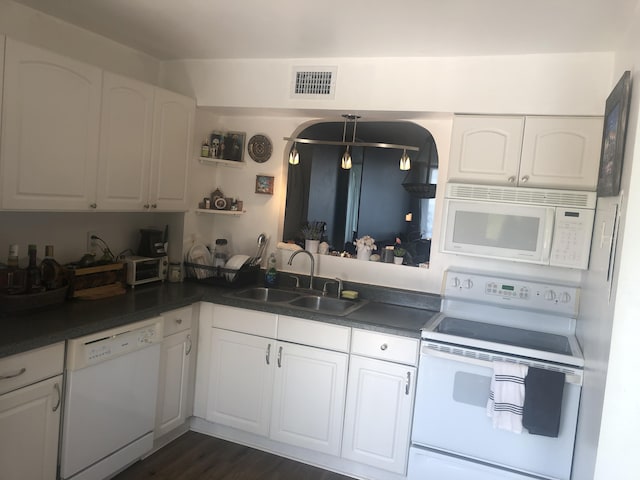 kitchen featuring white cabinetry, white appliances, sink, and dark wood-type flooring