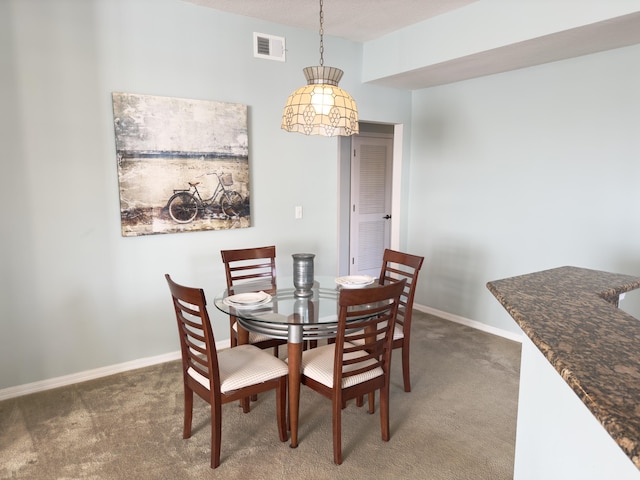 view of carpeted dining space