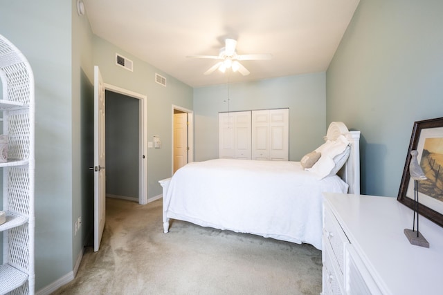 carpeted bedroom featuring a closet and ceiling fan