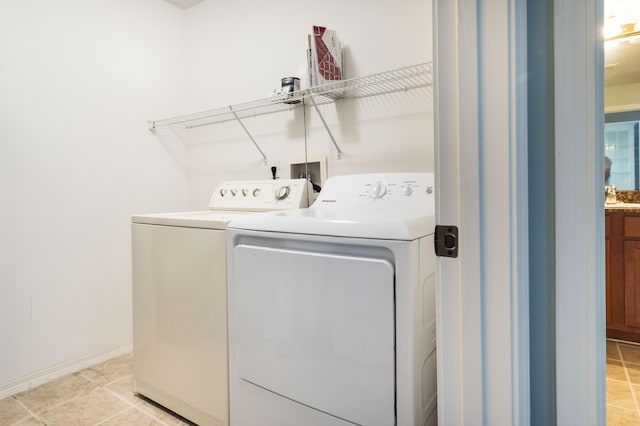 washroom with washing machine and clothes dryer