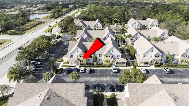 birds eye view of property with a water view