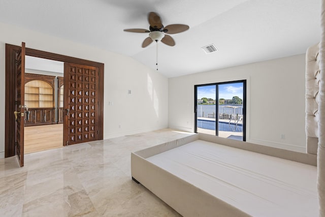 bedroom featuring access to outside, ceiling fan, and vaulted ceiling