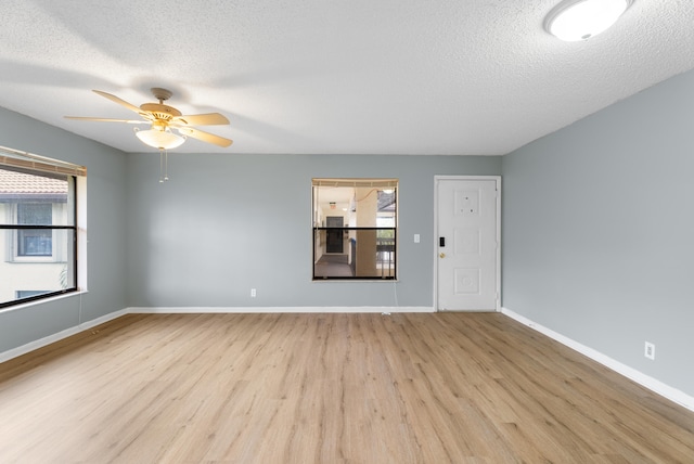 151 SW S River Dr Unit 203, Stuart, FL 34997 - unfurnished room with wood finished floors, a textured ceiling, and ceiling fan