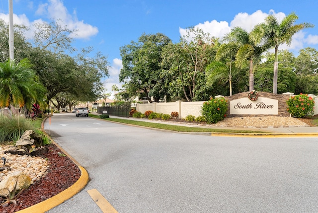 151 SW S River Dr Unit 203, Stuart, FL 34997 - view of asphalt street with curbs and sidewalks