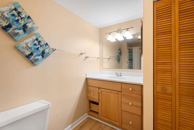 151 SW S River Dr Unit 203, Stuart, FL 34997 - bathroom with a closet, vanity, and wood finished floors