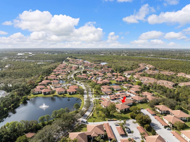 birds eye view of property featuring a water view and a residential view