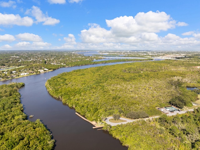 151 SW S River Dr Unit 203, Stuart, FL 34997 - bird's eye view of a nearby body of water and a heavily wooded area