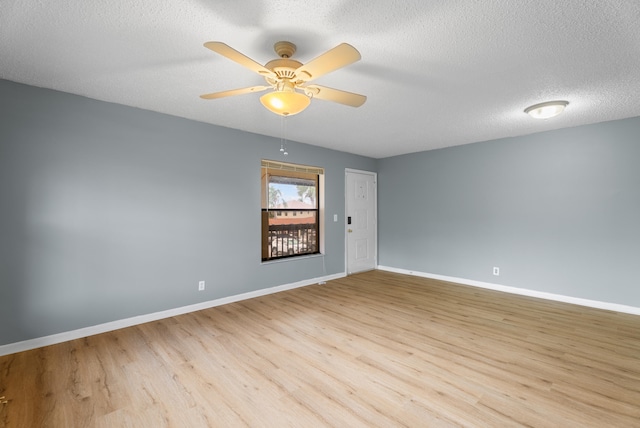 151 SW S River Dr Unit 203, Stuart, FL 34997 - empty room with light wood-style flooring, a ceiling fan, and a textured ceiling