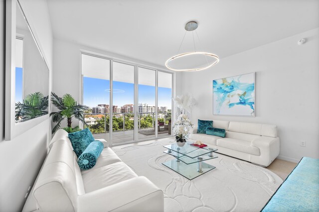 living room featuring a wall of windows