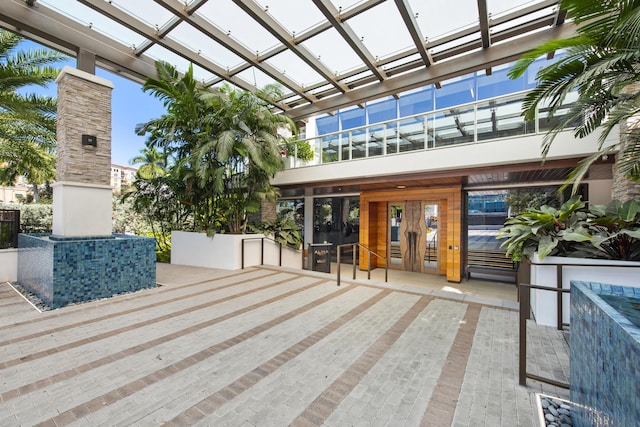 exterior space with a pergola and french doors