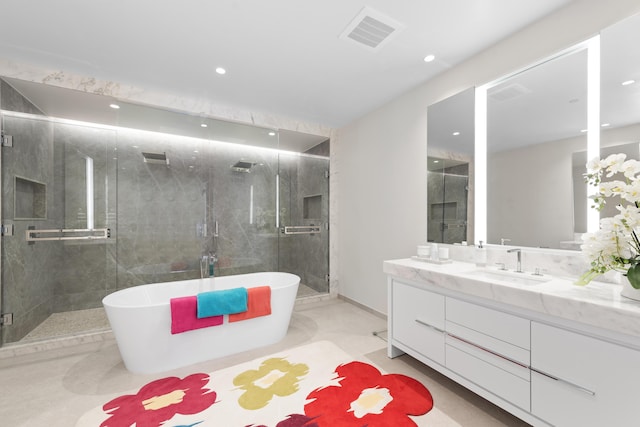 bathroom featuring vanity and shower with separate bathtub