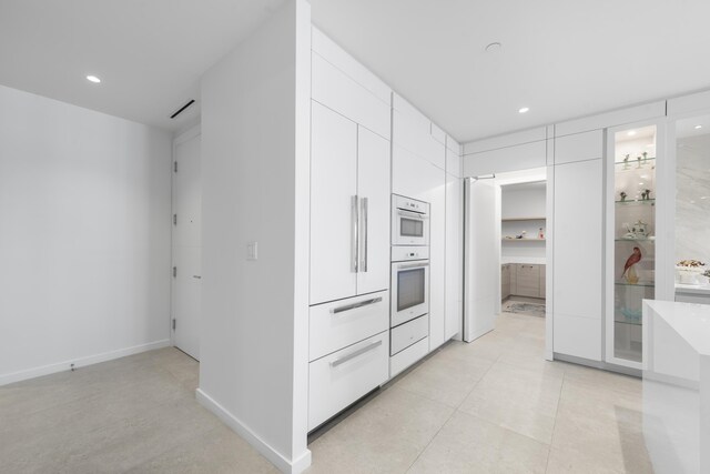 full bathroom featuring tile patterned floors, toilet, combined bath / shower with glass door, and vanity