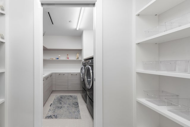 clothes washing area with independent washer and dryer