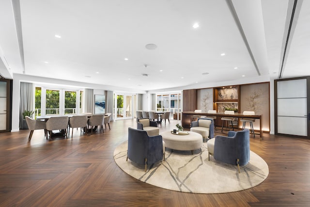 living room featuring dark parquet flooring