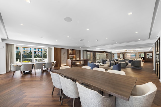 dining area with dark parquet flooring