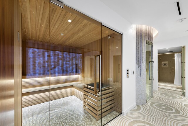 bathroom featuring wood walls