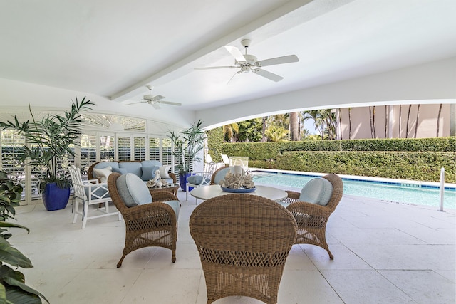 view of patio / terrace featuring a fenced in pool, outdoor lounge area, and ceiling fan