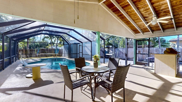 view of swimming pool with a lanai, ceiling fan, and a patio area