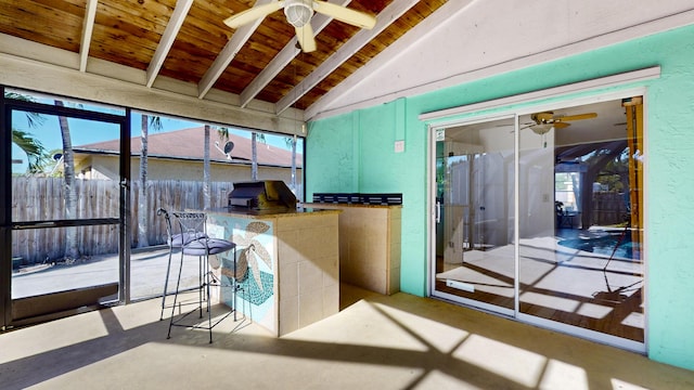 interior space with wood ceiling and lofted ceiling with beams