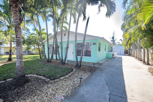 view of front of home with an outbuilding and a garage