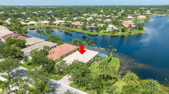 birds eye view of property with a water view and a residential view