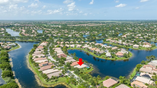 drone / aerial view with a water view and a residential view