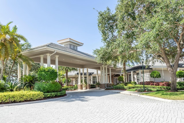 view of home's community featuring decorative driveway