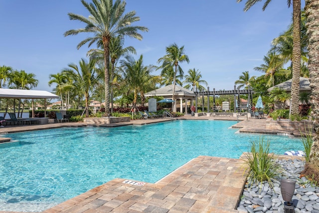 community pool with a patio area