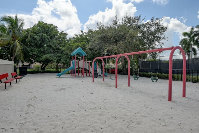 community jungle gym featuring fence