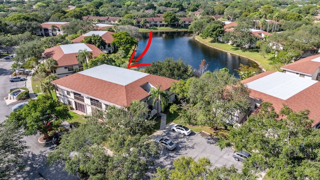 birds eye view of property with a water view