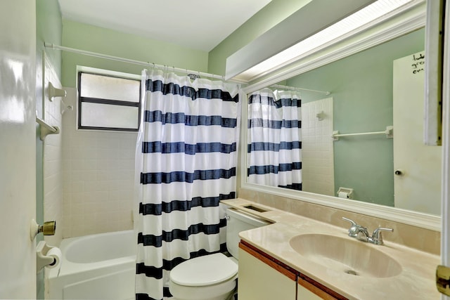 full bathroom featuring vanity, shower / bath combination with curtain, and toilet