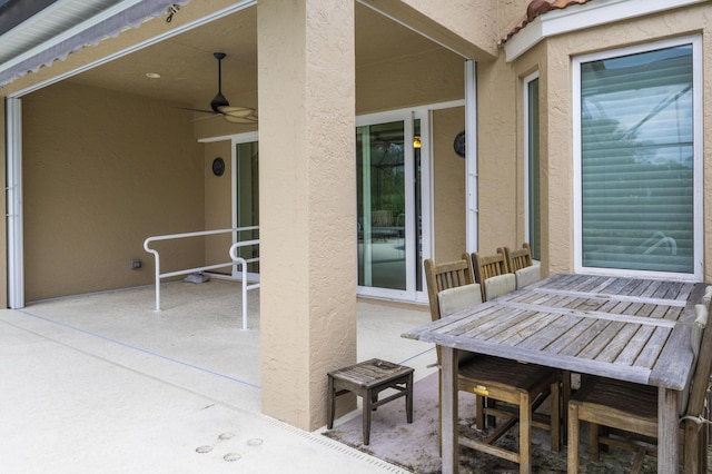 view of patio featuring ceiling fan