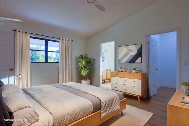 bedroom with ensuite bath, ceiling fan, dark hardwood / wood-style floors, and lofted ceiling