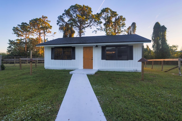 view of front of house with a lawn