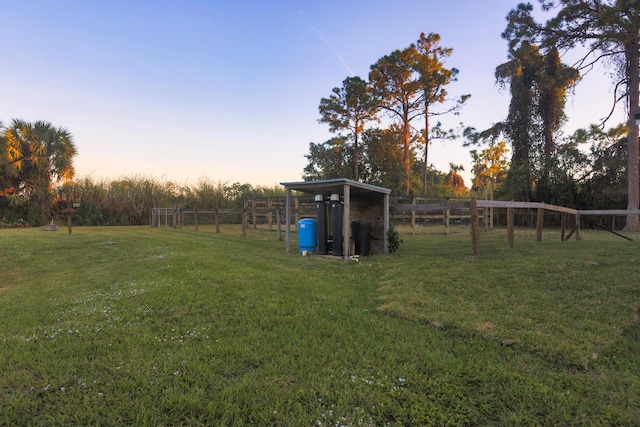 view of yard at dusk