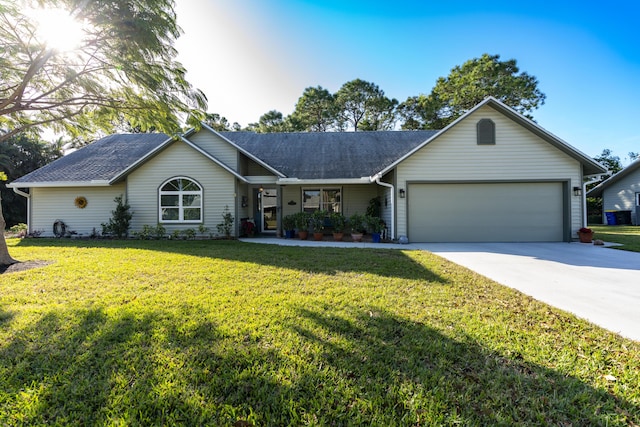 ranch-style home with a front yard and a garage