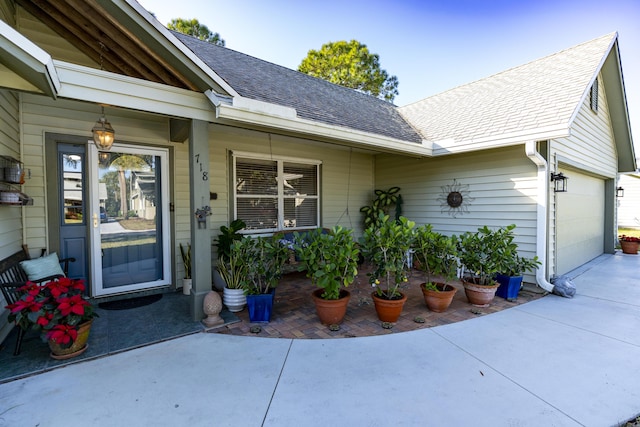 doorway to property with a garage