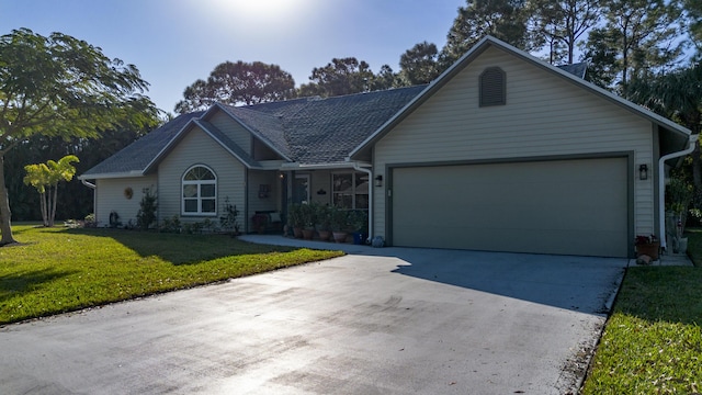 single story home featuring a front yard and a garage