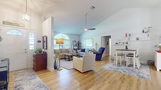 foyer featuring ceiling fan, high vaulted ceiling, and light hardwood / wood-style floors