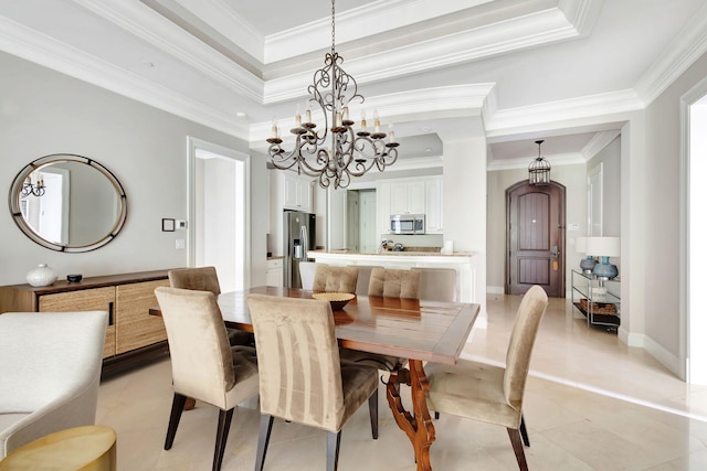 dining area with light tile patterned floors, a raised ceiling, and ornamental molding