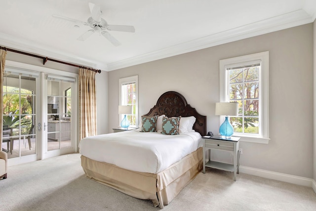 bedroom featuring access to exterior, ceiling fan, light colored carpet, and multiple windows