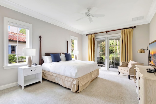 carpeted bedroom featuring ceiling fan, ornamental molding, access to outside, and multiple windows