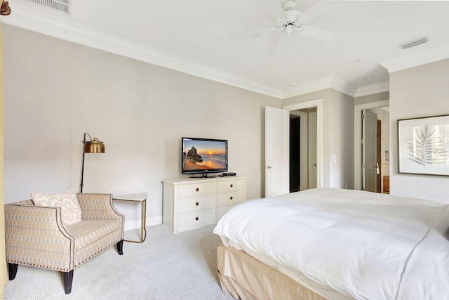 bedroom with ceiling fan, crown molding, and light colored carpet