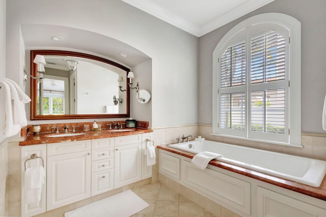 bathroom featuring tile patterned flooring, vanity, a healthy amount of sunlight, and ornamental molding