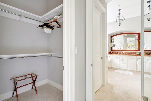 bathroom featuring tile patterned flooring and vanity