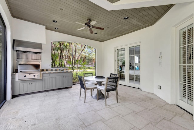 view of patio featuring french doors, ceiling fan, and a grill